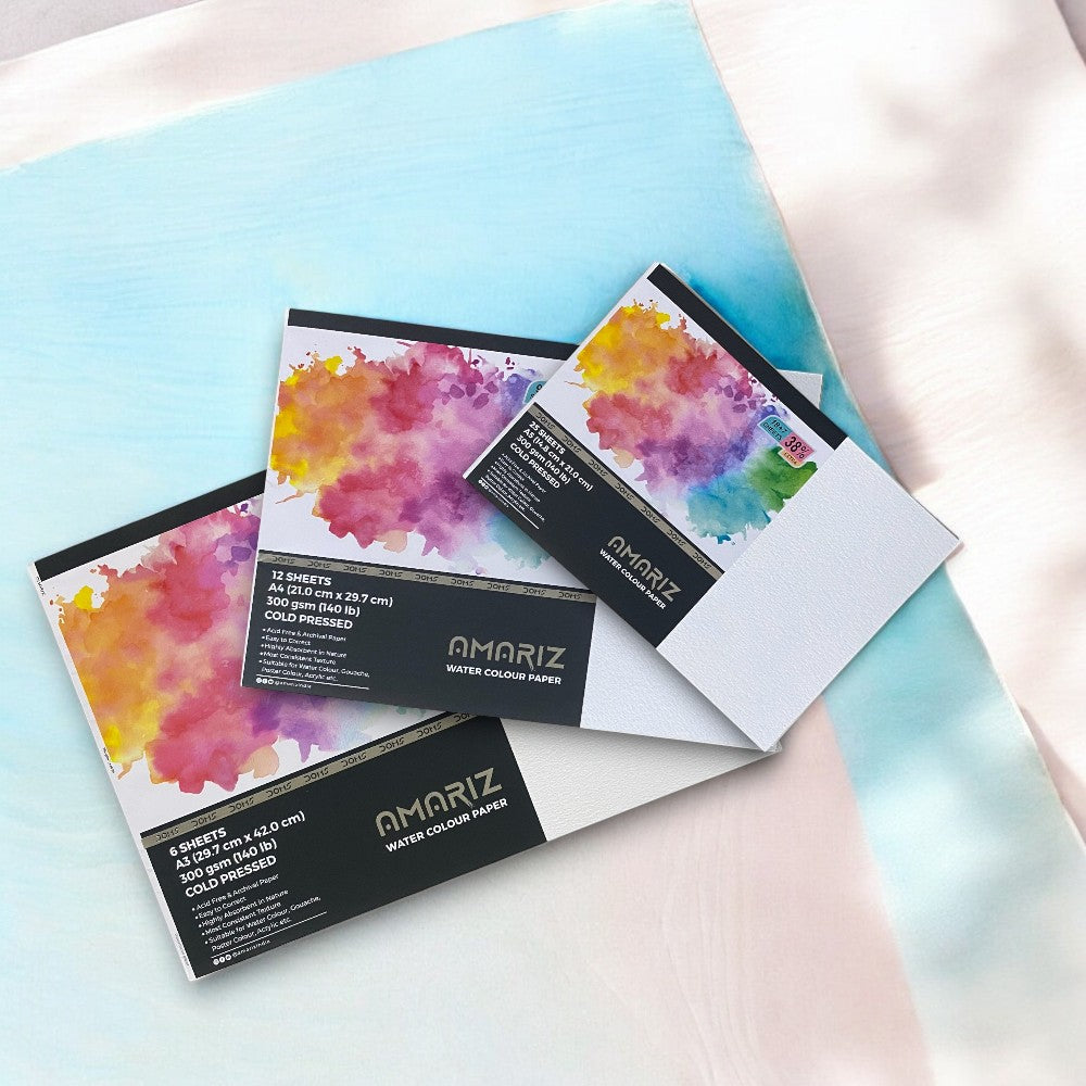 Flatlay of Doms Amariz 300gsm Watercolour Paper Sheets in A3, A4, A5 Sizes