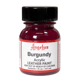 A small bottle of Angelus brand leather paint labeled "Burgundy" containing 1 fl. oz. (29.5 ml) of acrylic paint. The label advises to keep out of reach of children.  