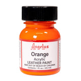 A small bottle of Angelus brand leather paint labeled "Orange" containing 1 fl. oz. (29.5 ml) of acrylic paint. The label advises to keep out of reach of children.  