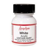 A small bottle of Angelus brand leather paint labeled "White" containing 1 fl. oz. (29.5 ml) of acrylic paint. The label advises to keep out of reach of children.  