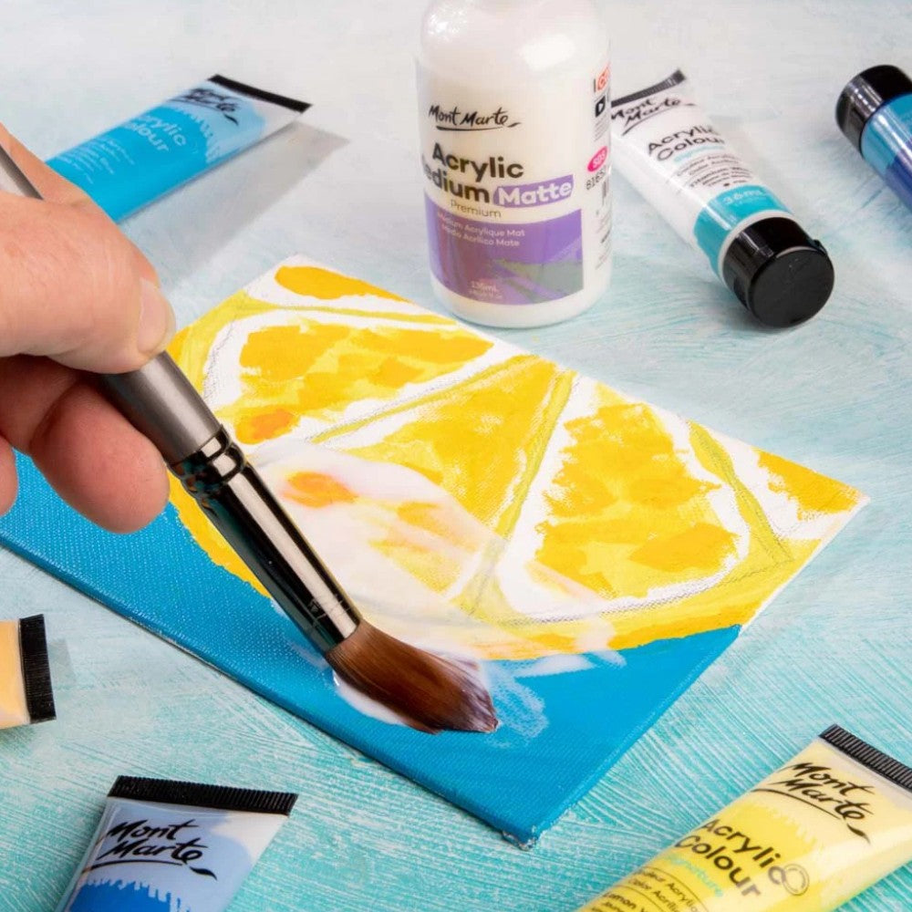 Using Mont Marte Acrylic Matte Medium on a canvas with a brush