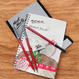 Flatlay of Mont Marte Sketching Set with Pencils, Book, and Wallet
